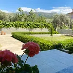 Flowery House Near The Sea And The Mountain