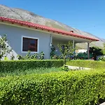 Flowery House Near The Sea And The Mountain
